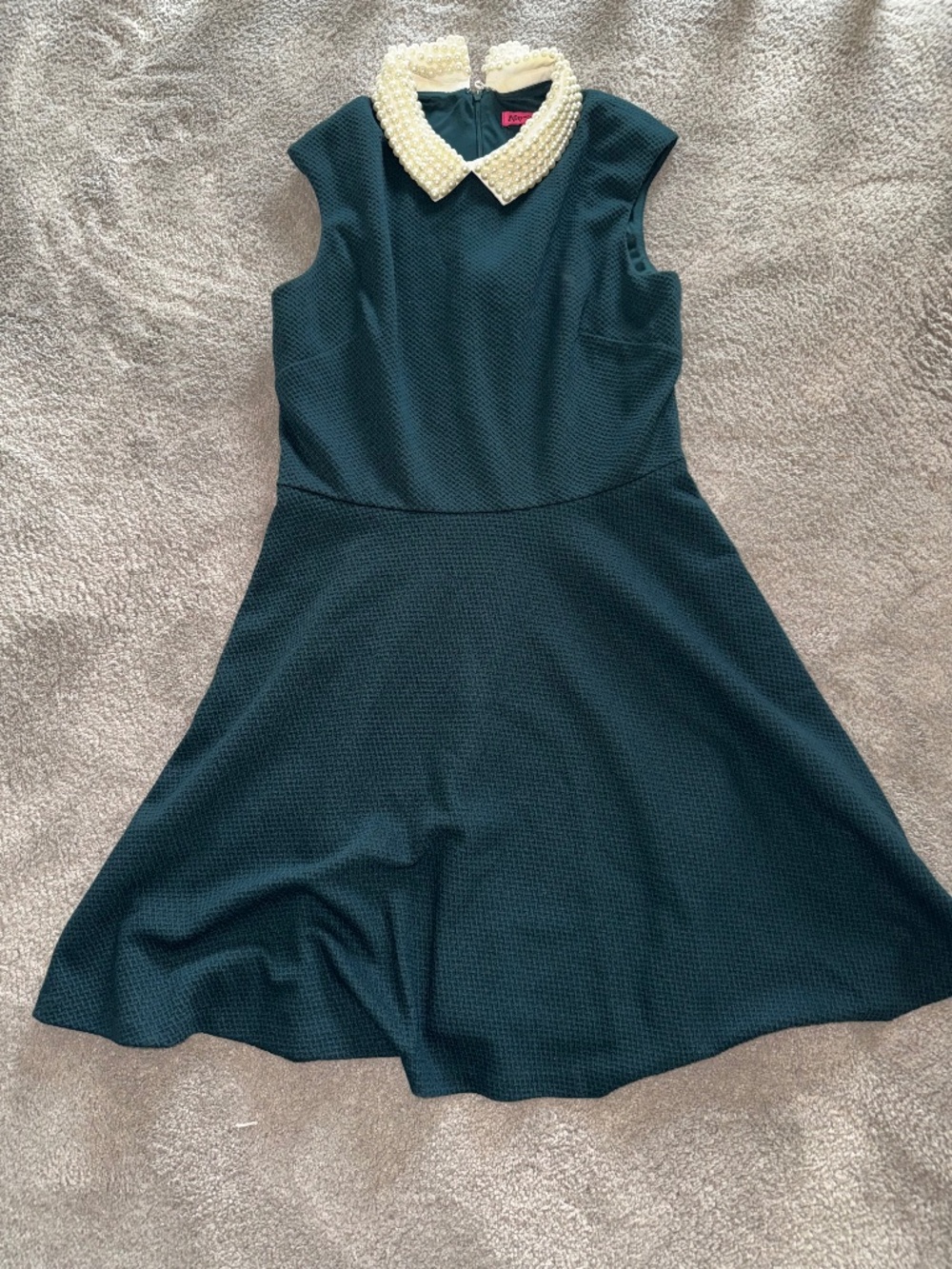 Betsey Johnson dress with textured fabric and a decorative pearl like collar